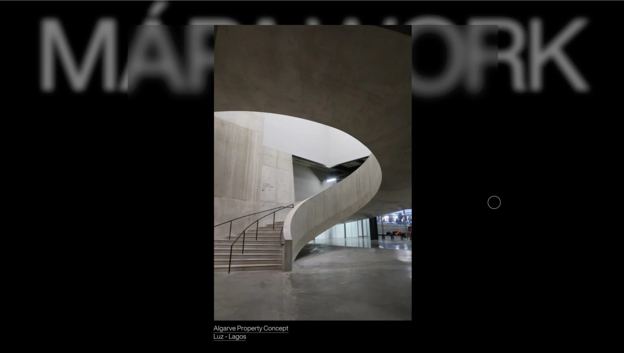Website screen with a photo of a curved concrete staircase over a blurred MÁPA WORK title on black, for Mapa.